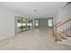 Spacious living area with sliding glass doors leading to the backyard at 3860 Rose Malllow Dr, Kissimmee, FL 34746