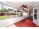 Spacious screened porch with ceiling fan, overlooking backyard and deck at 3229 Clewiston St, Deltona, FL 32738