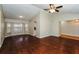 Living room with hardwood floors, bay window and access to the kitchen at 3229 Clewiston St, Deltona, FL 32738
