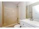 Clean bathroom with shower/tub combo and white vanity at 3229 Clewiston St, Deltona, FL 32738