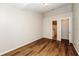 Bright bedroom with wood-look floors and ample closet space at 3229 Clewiston St, Deltona, FL 32738