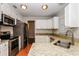 Modern kitchen with stainless steel appliances and granite countertops at 3229 Clewiston St, Deltona, FL 32738
