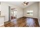 Living area with dark hardwood floors, sliding door to patio at 3229 Clewiston St, Deltona, FL 32738