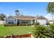 Charming one-story home with a well-maintained lawn and attached garage at 3229 Clewiston St, Deltona, FL 32738