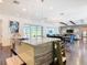 Open concept kitchen with large island and hardwood floors at 15680 Panther Lake Dr, Winter Garden, FL 34787