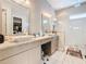 Main bathroom with double sinks, walk in shower, and granite at 15680 Panther Lake Dr, Winter Garden, FL 34787