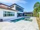 Two-story home with pool, patio, and lush landscaping at 15680 Panther Lake Dr, Winter Garden, FL 34787