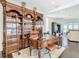 Spacious home office with custom wood desk and built-in shelving at 15680 Panther Lake Dr, Winter Garden, FL 34787