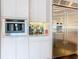 Modern kitchen with built in espresso machine and wine storage at 15680 Panther Lake Dr, Winter Garden, FL 34787