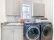Laundry room with LG washer and dryer and granite countertop at 15680 Panther Lake Dr, Winter Garden, FL 34787