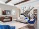 Open concept living room with hardwood floors, a fireplace, and modern furniture at 15680 Panther Lake Dr, Winter Garden, FL 34787