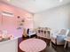 Charming Bedroom with star wall decals, crib, and comfy armchair at 15680 Panther Lake Dr, Winter Garden, FL 34787