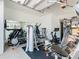 Home gym with various exercise machines and mirror at 15680 Panther Lake Dr, Winter Garden, FL 34787
