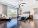 Spacious main bedroom with dark hardwood floors and large windows at 15680 Panther Lake Dr, Winter Garden, FL 34787
