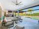 Relaxing outdoor patio with seating and views of the pool and landscaping at 15680 Panther Lake Dr, Winter Garden, FL 34787