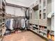 Spacious walk-in closet with custom built-ins and shoe storage at 15680 Panther Lake Dr, Winter Garden, FL 34787