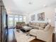 Gathering room with comfortable seating and large windows at 15680 Panther Lake Dr, Winter Garden, FL 34787