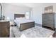 Cozy bedroom with a comfortable bed and plenty of closet space at 15680 Panther Lake Dr, Winter Garden, FL 34787