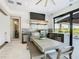 Stainless steel outdoor kitchen with grill, countertops, and dining area at 15680 Panther Lake Dr, Winter Garden, FL 34787