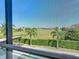 View from balcony showcasing green space and homes at 15680 Panther Lake Dr, Winter Garden, FL 34787