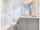 Modern bathroom with a walk-in shower and gray vanity at 15680 Panther Lake Dr, Winter Garden, FL 34787