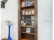 Built-in shelves with books, decorative items, and Gathering photos at 15680 Panther Lake Dr, Winter Garden, FL 34787