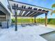 Covered patio with lounge chairs, adjacent to a refreshing pool at 15680 Panther Lake Dr, Winter Garden, FL 34787