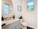 Small powder room with granite countertop and vanity at 15680 Panther Lake Dr, Winter Garden, FL 34787