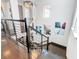 Elegant staircase with modern railing and chandelier at 15680 Panther Lake Dr, Winter Garden, FL 34787