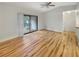 Spacious living room with light wood flooring and sliding glass doors at 232 Riverbend Dr # 201, Altamonte Springs, FL 32714