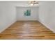 Bright bedroom featuring wood-look floors and a window at 232 Riverbend Dr # 201, Altamonte Springs, FL 32714