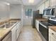 Modern kitchen with stainless steel appliances and granite countertops at 232 Riverbend Dr # 201, Altamonte Springs, FL 32714