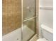 Clean bathroom with a shower/tub combo and tile surround at 232 Riverbend Dr # 201, Altamonte Springs, FL 32714
