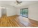 Bright living room featuring hardwood floors and sliding glass doors at 232 Riverbend Dr # 201, Altamonte Springs, FL 32714