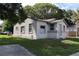 A small house with a front yard, driveway and street view at 2351 S Ronald Reagan Blvd, Altamonte Springs, FL 32701