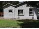 Side view of a small house with windows and siding at 2351 S Ronald Reagan Blvd, Altamonte Springs, FL 32701