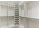 Spacious walk-in closet with ample shelving and hanging space at 840 Kenilworth Ter, Orlando, FL 32803