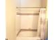 Clean bathroom with shower/tub combo and neutral tile at 6682 Time Square Ave # 101, Orlando, FL 32835