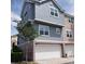 Two-story townhome with attached garage and neutral colors at 6682 Time Square Ave # 101, Orlando, FL 32835