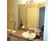 Bathroom with vanity and large mirror at 6682 Time Square Ave # 101, Orlando, FL 32835