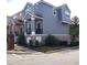 Two-story townhome with modern exterior and landscaping at 6682 Time Square Ave # 101, Orlando, FL 32835