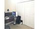 Bedroom with computer setup and closet at 6682 Time Square Ave # 101, Orlando, FL 32835