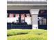 Restaurant patio with Dos Equis flags at 6682 Time Square Ave # 101, Orlando, FL 32835