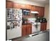 Kitchen with wood cabinets and appliances at 6682 Time Square Ave # 101, Orlando, FL 32835