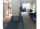 Living room with couches and view into kitchen area at 6682 Time Square Ave # 101, Orlando, FL 32835