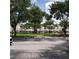 Community with green space and apartment buildings at 6682 Time Square Ave # 101, Orlando, FL 32835