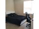 Bedroom with bed and gaming chair at 6682 Time Square Ave # 101, Orlando, FL 32835