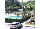 Community pool with gazebo and surrounding landscaping at 6682 Time Square Ave # 101, Orlando, FL 32835