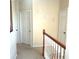 Upstairs hallway with two closets and neutral walls at 6682 Time Square Ave # 101, Orlando, FL 32835