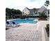 Inviting community pool with lounge chairs and umbrellas at 6682 Time Square Ave # 101, Orlando, FL 32835